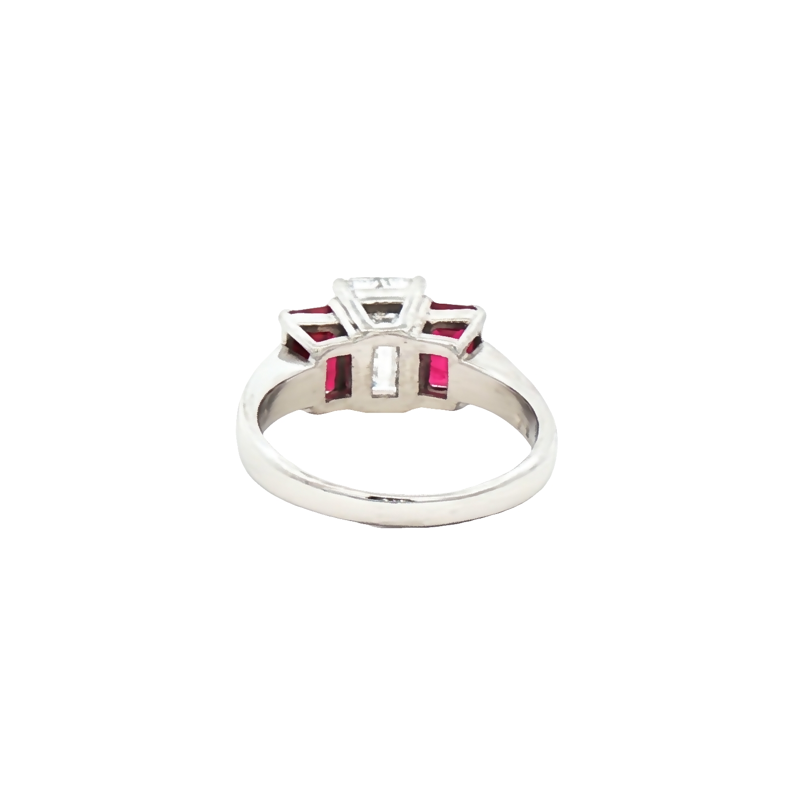 Platinum ring with a 1.65 ct GIA certified D VS1 emerald-cut diamond flanked by 2.85 ct emerald-cut rubies