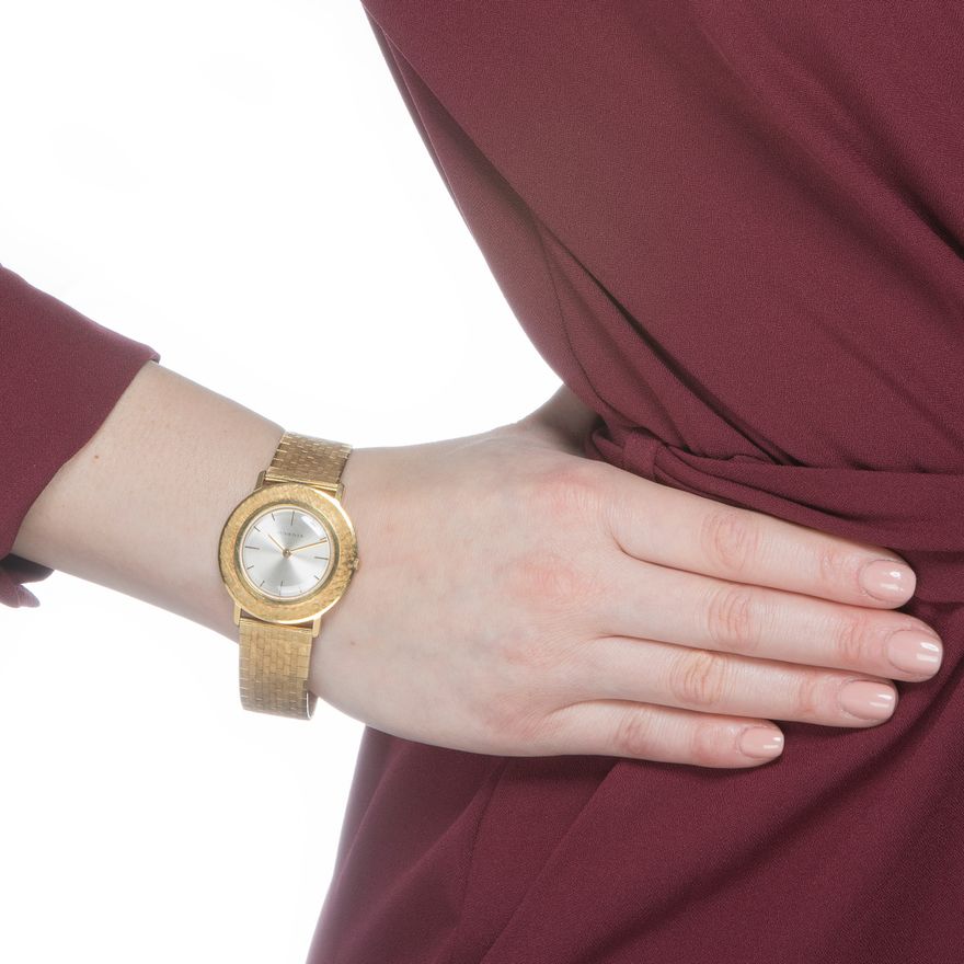 Juvenia lady’s 18K yellow-gold wristwatch with cross-Florentine textured circular case