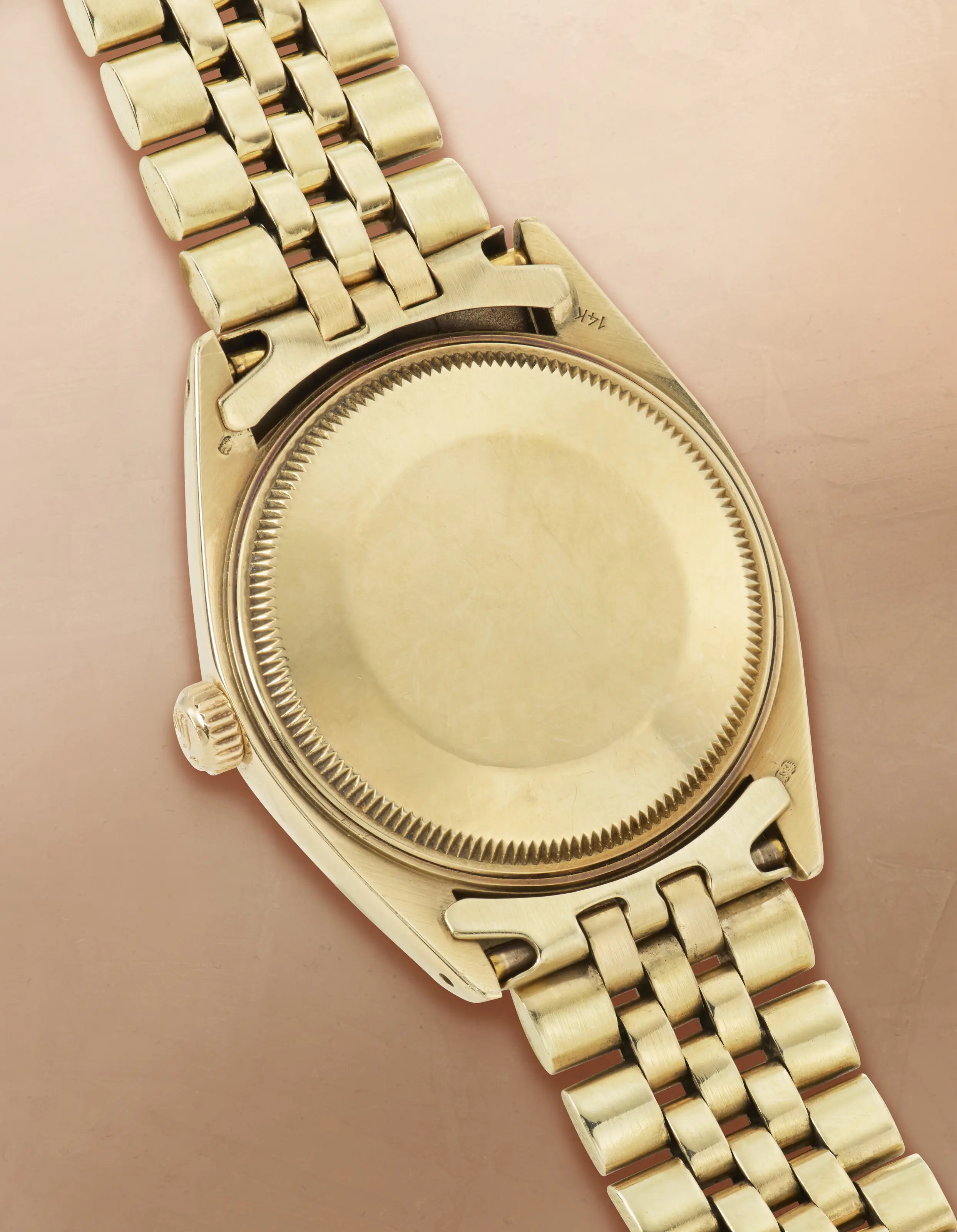 Vintage 1976 Rolex Oyster Perpetual Date Reference 1503 watch featuring a solid 14K gold case, a deep blue dial, and a matching 14K gold Jubilee bracelet.