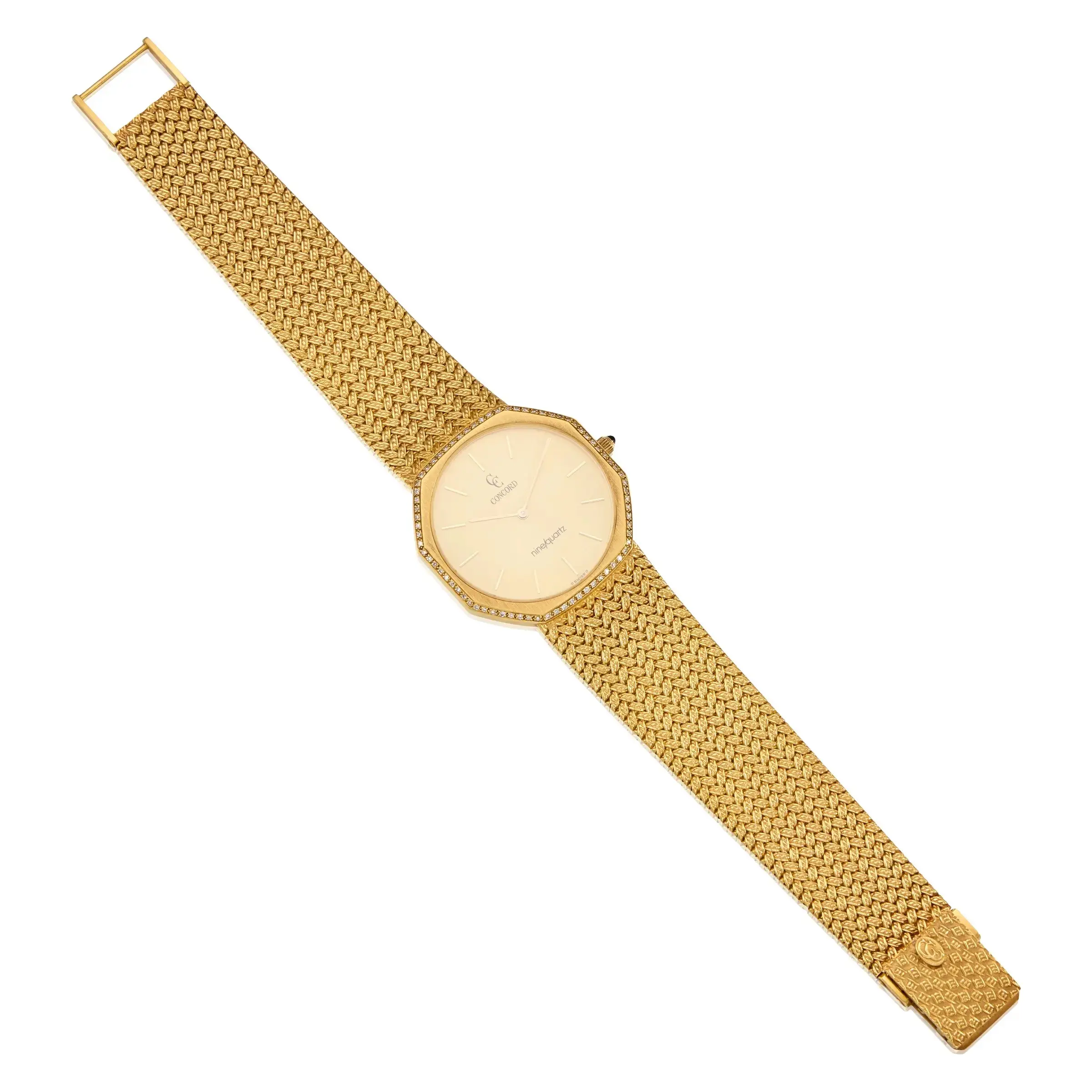 Vintage Concord Mariner Nine/Quartz ultra-thin watch featuring a solid 18K yellow gold case, round-cut diamonds, and an integrated gold bracelet.