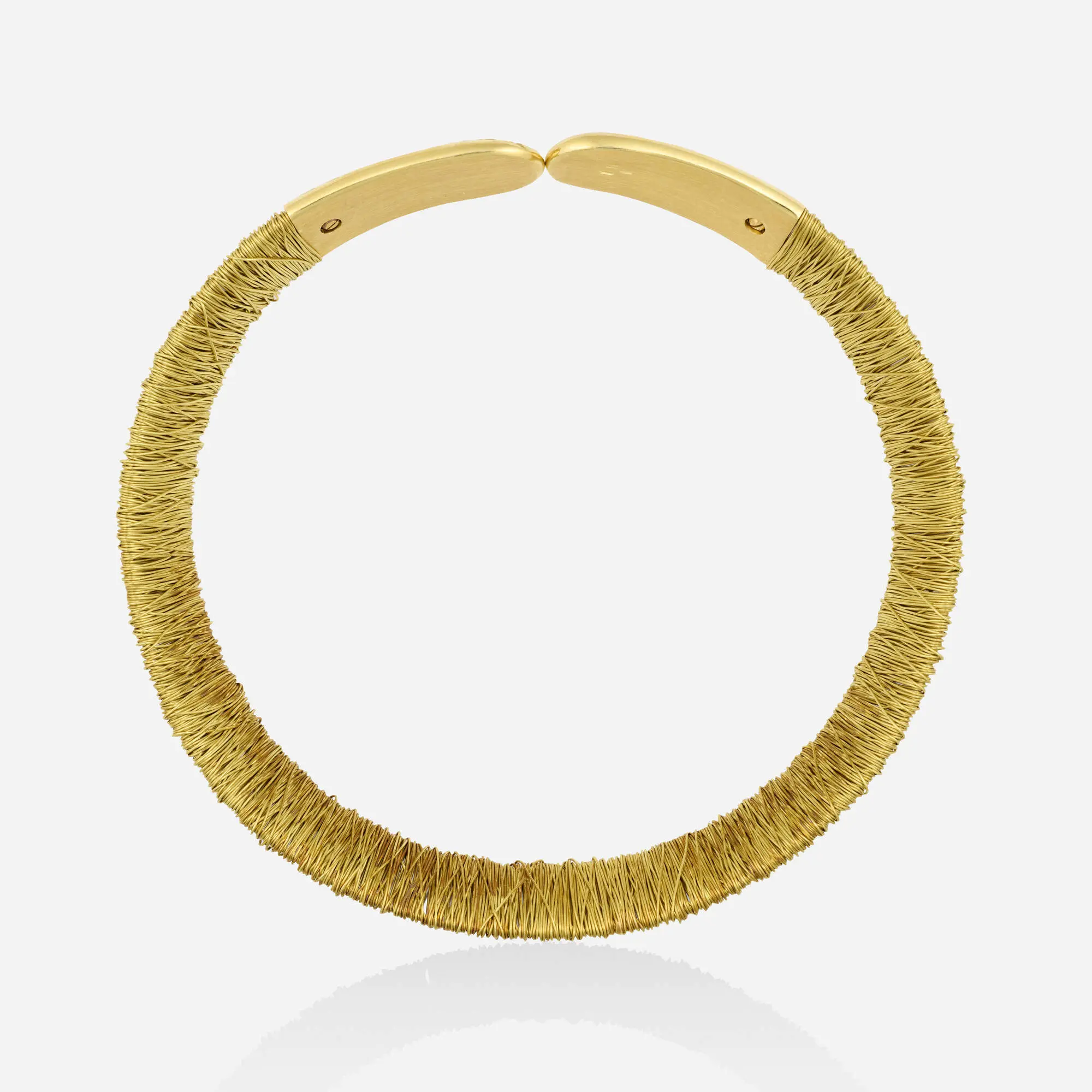 Pasquale Bruni 18k yellow gold and steel wrapped wire collar necklace showing the 'AMOR EST VITA' engraving on the terminal.