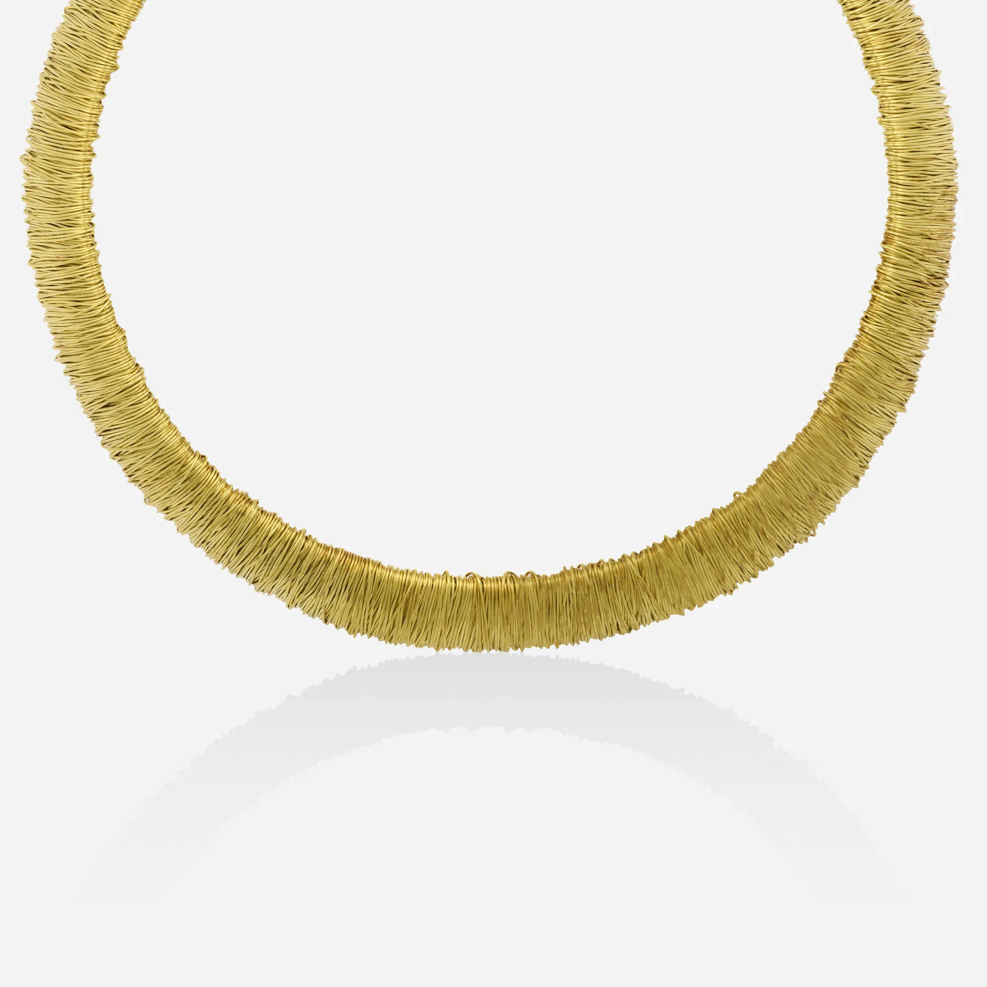 Pasquale Bruni 18k yellow gold and steel wrapped wire collar necklace showing the 'AMOR EST VITA' engraving on the terminal.
