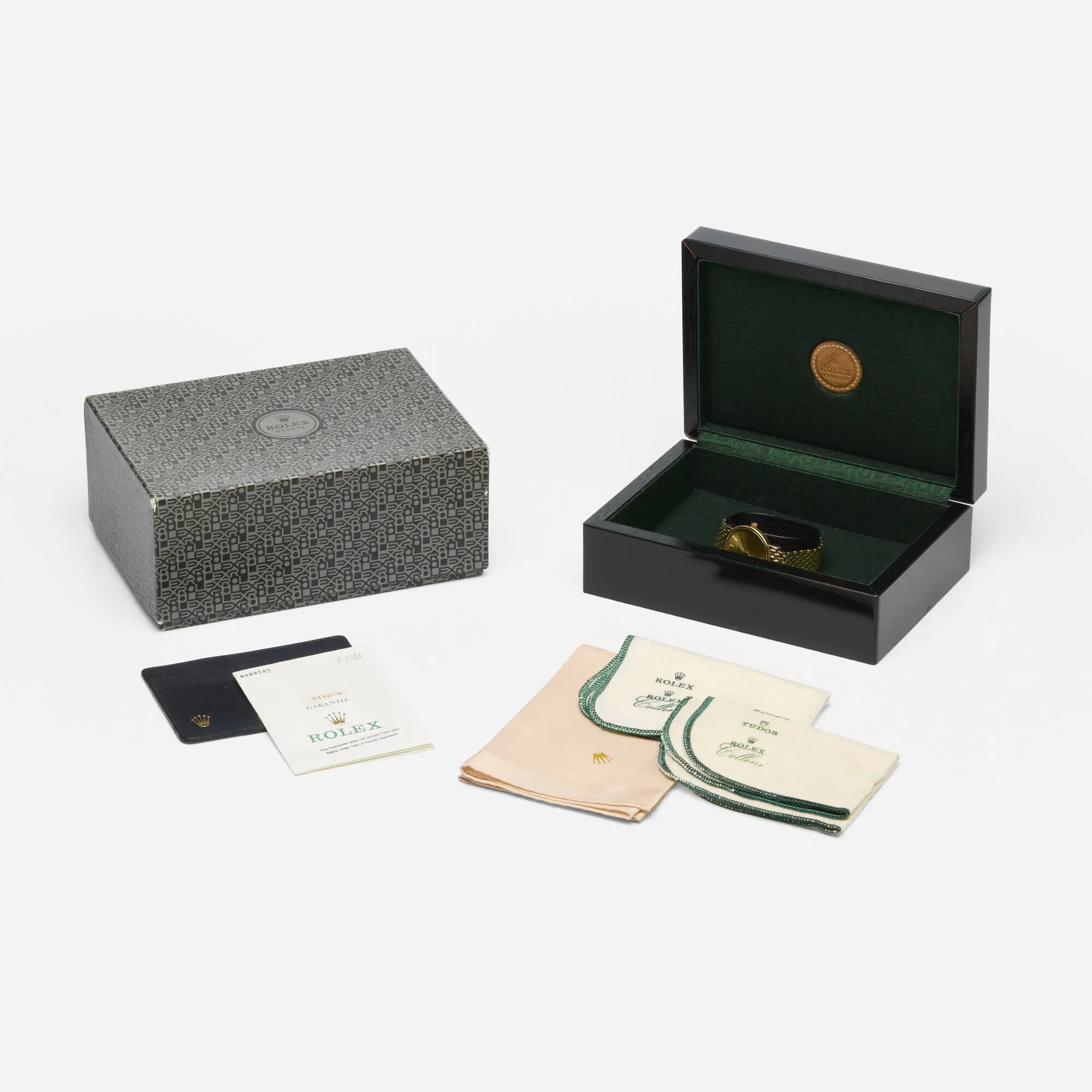 Vintage Rolex Cellini Ref. 5112 solid 18k yellow gold manual-wind 32mm dress watch with gold baton dial, integrated gold bracelet, original box, and guarantee papers.