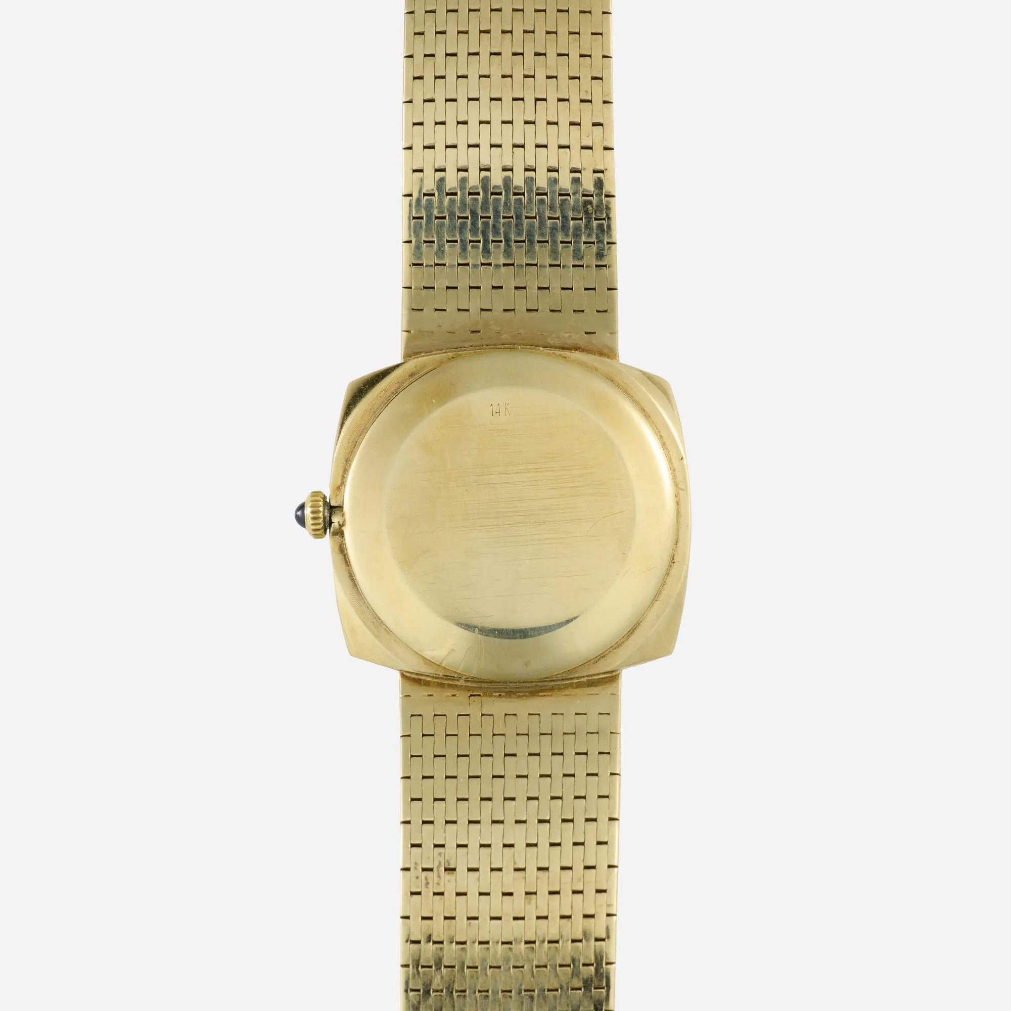Vintage double-signed Universal Genève for Van Cleef & Arpels 14k yellow gold manual-wind bracelet watch with a violetish-blue lapis lazuli stone dial and sword hands.