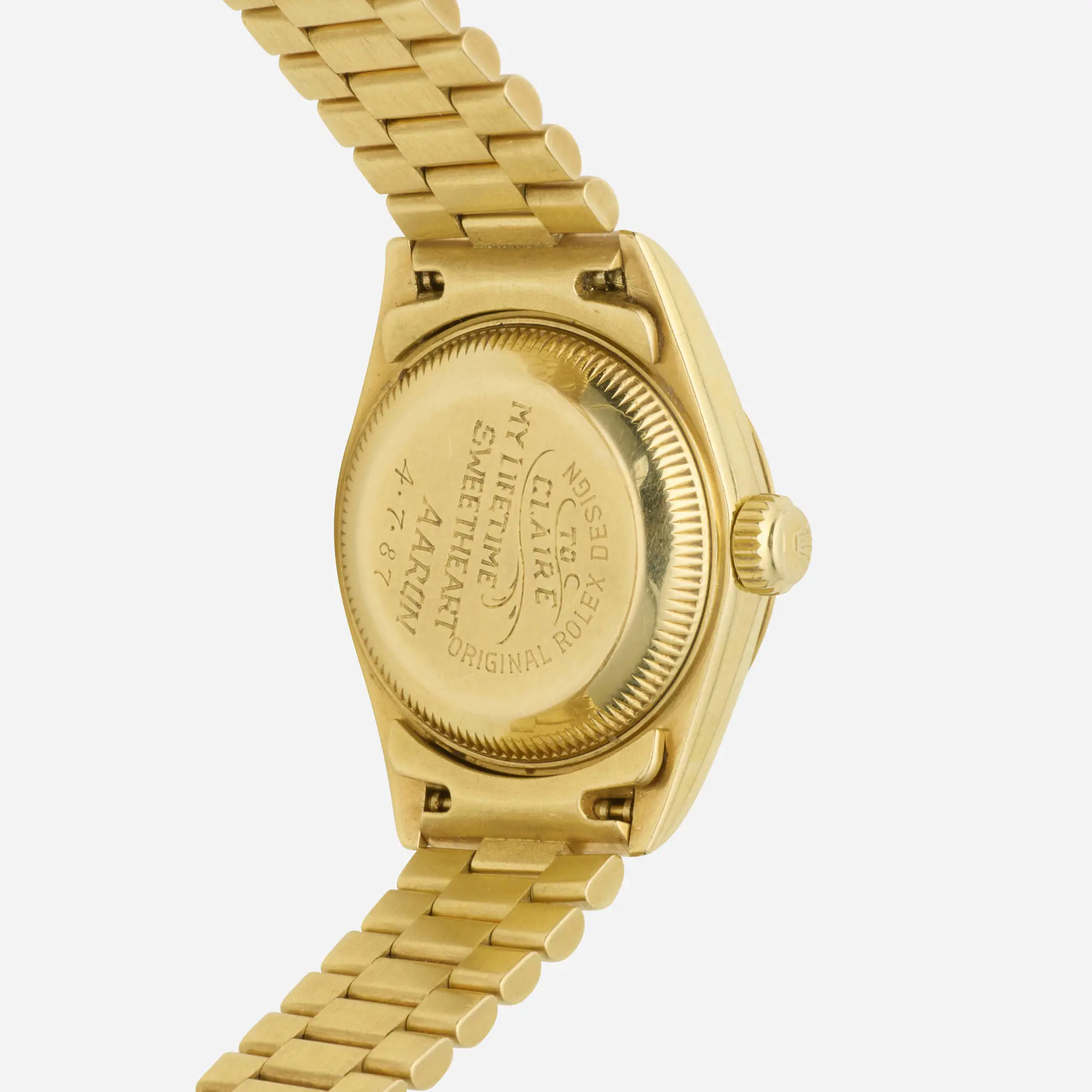 Vintage circa 1987 Rolex Lady-Datejust Reference 69178 solid 18k yellow gold 26mm automatic wristwatch with gold dial and President bracelet with deployant clasp.