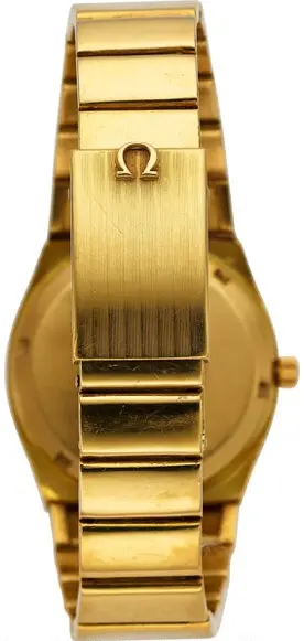 1972 vintage 18k solid gold Omega Constellation Ref. 398.0819 with silver dial and integrated 18k gold link bracelet.
