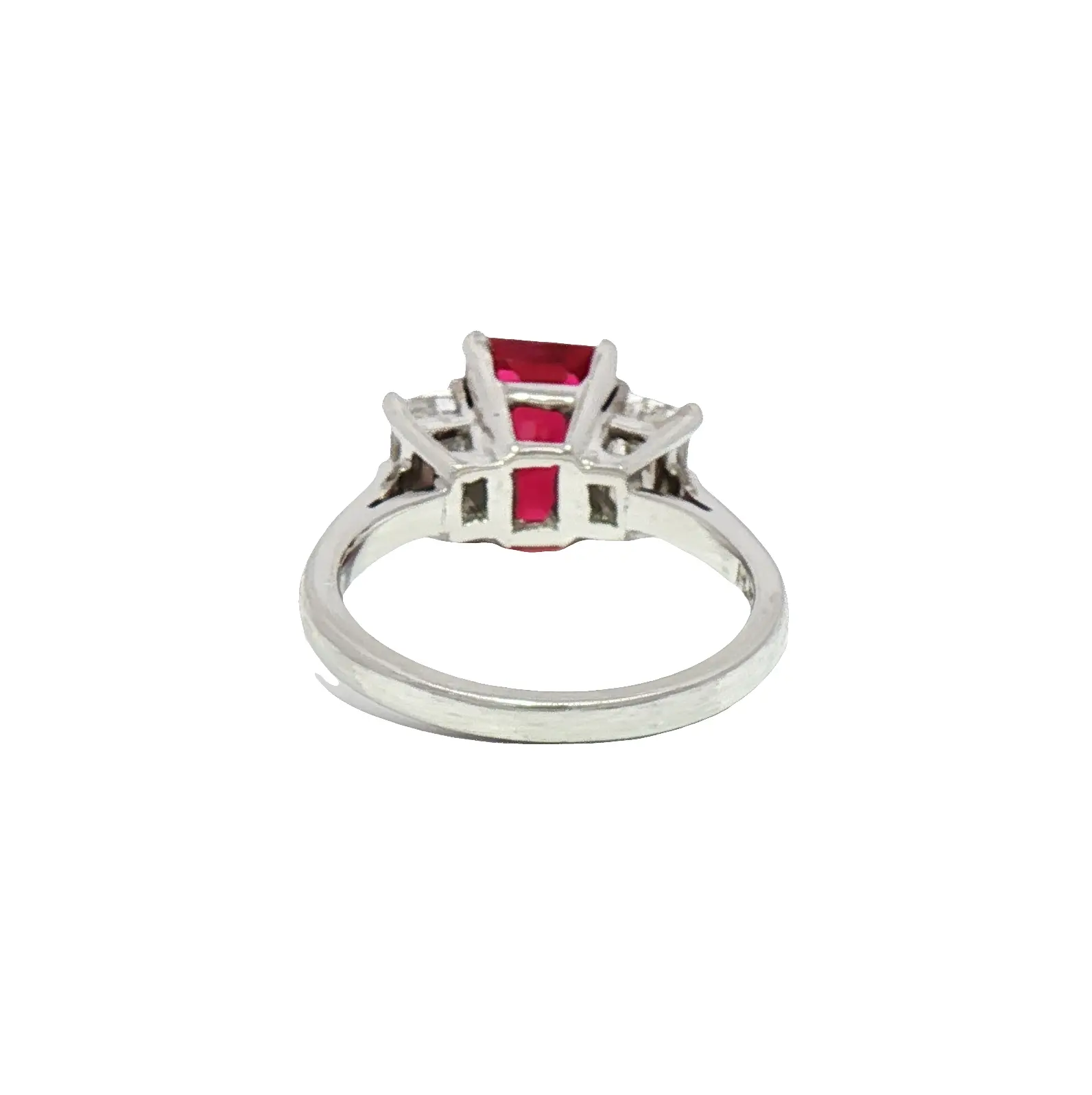 High-jewelry platinum ring featuring a 2.02-carat Burmese emerald-cut ruby with diamond accents, Sotheby’s Christie’s auction style