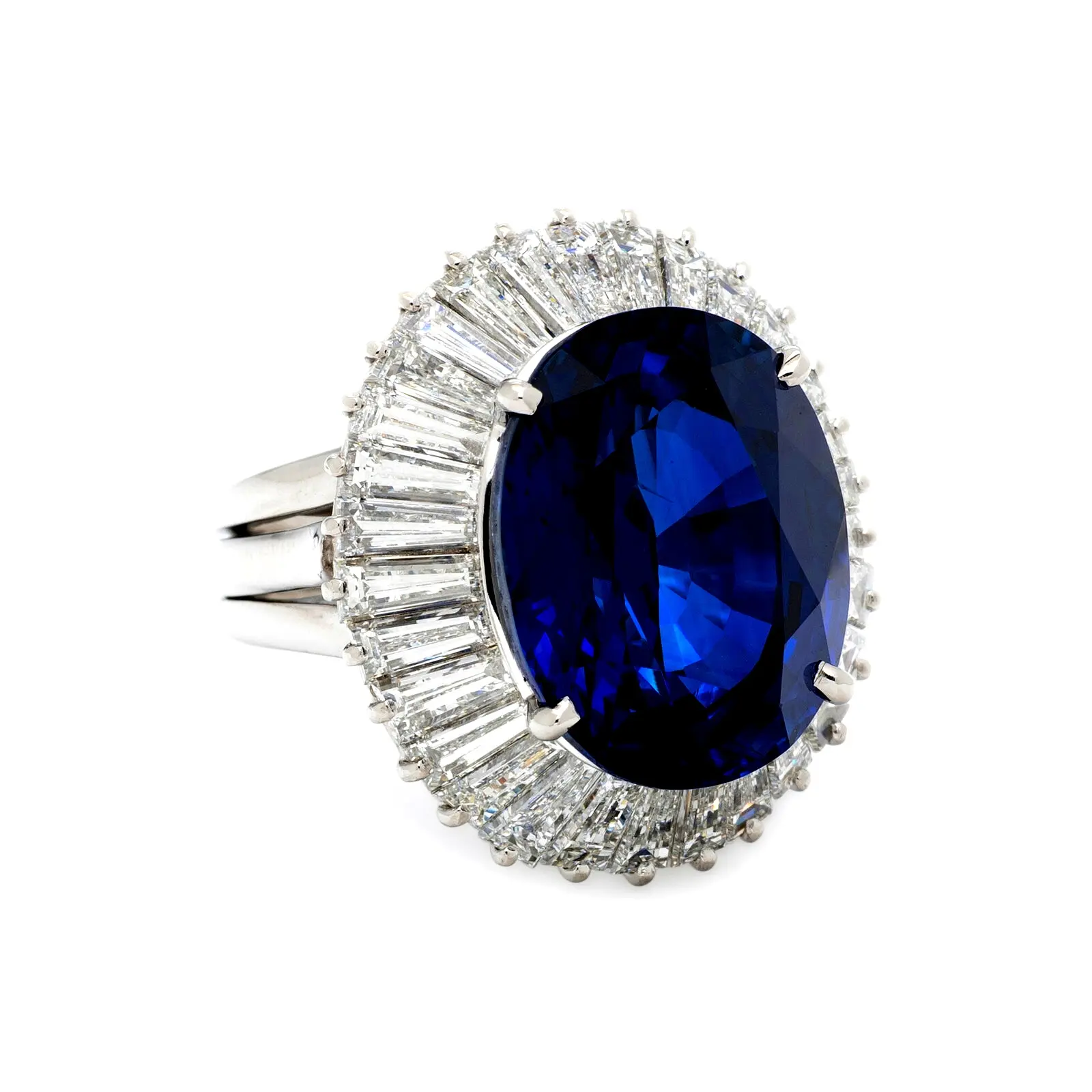 Platinum ballerina ring with ~19.15-carat oval sapphire and tapered baguette-diamond halo; ring size 6; GIA-reported Madagascar origin.