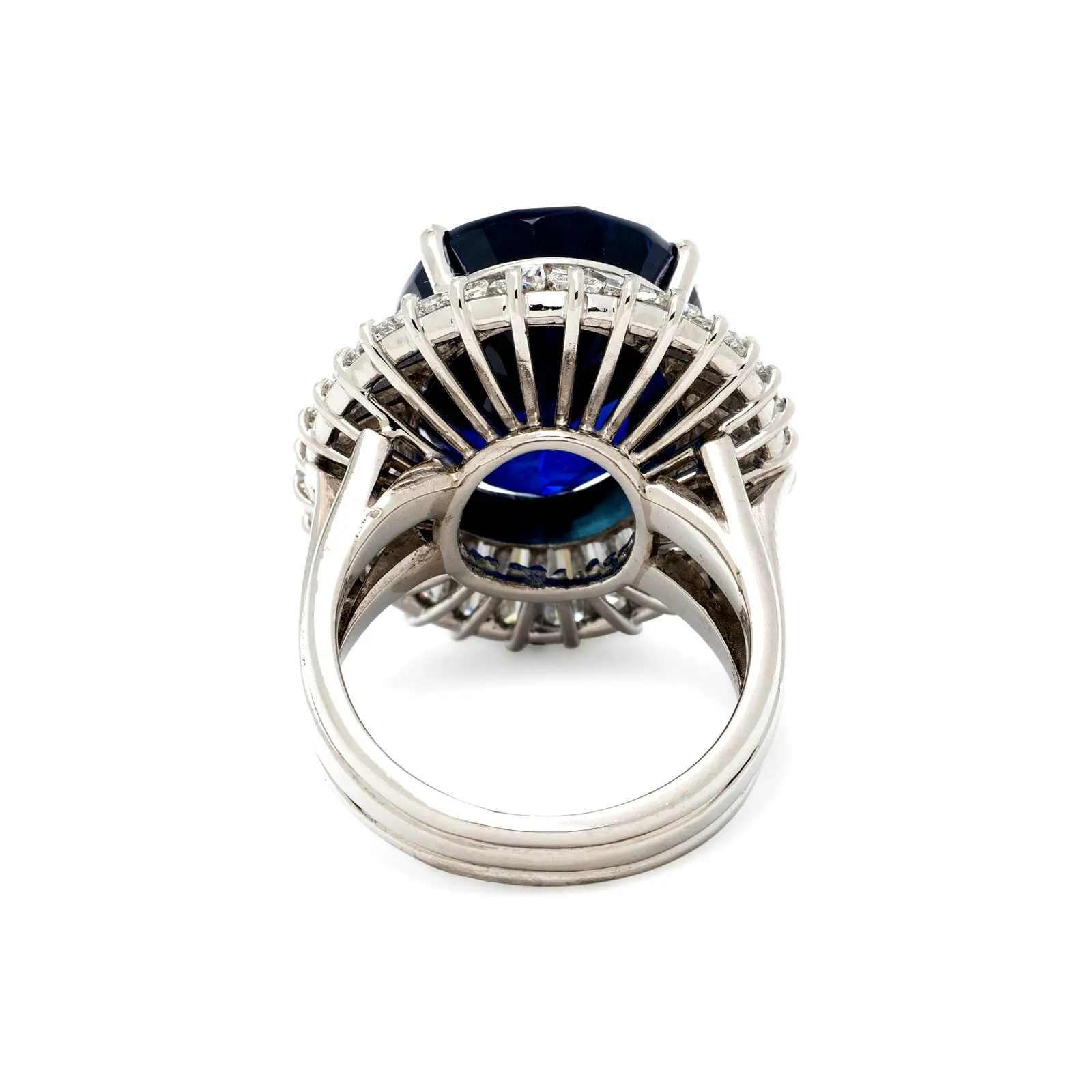 Platinum ballerina ring with ~19.15-carat oval sapphire and tapered baguette-diamond halo; ring size 6; GIA-reported Madagascar origin.