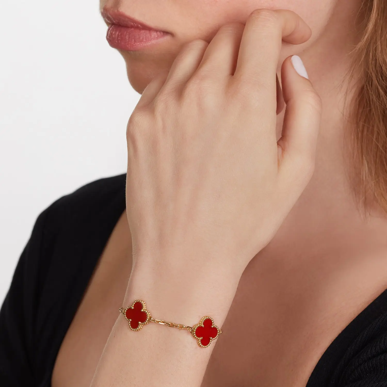 Vintage Alhambra carnelian bracelet by Van Cleef & Arpels shown on wrist, 18K yellow gold beaded mounts