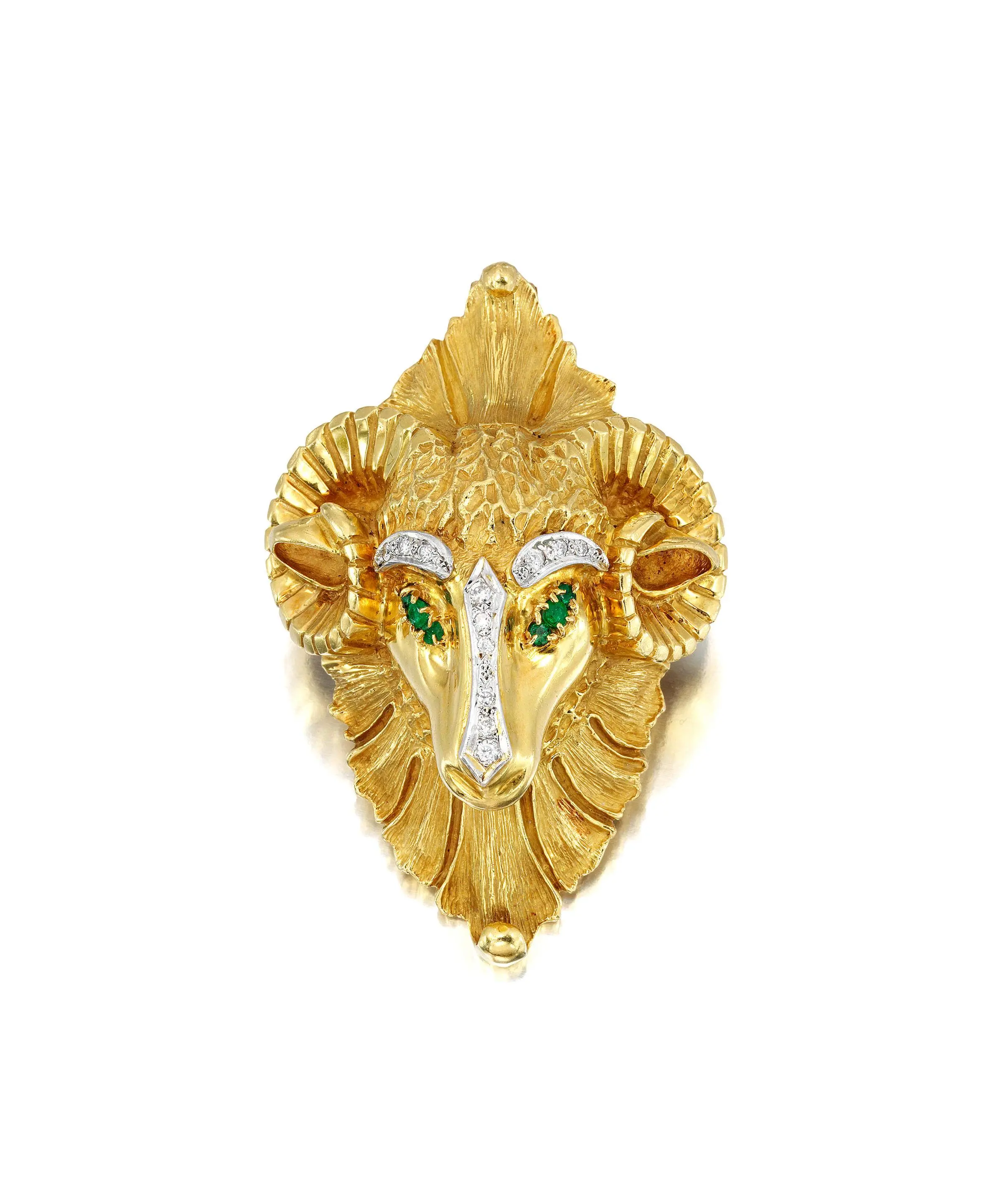 18K yellow gold Ram’s Head brooch with emerald eyes and round brilliant-cut diamond accents, 3×2 inches, 91 grams, attributed to Hammerman Brothers (unsigned).