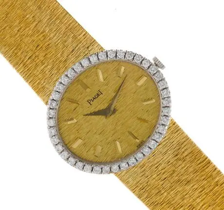 Piaget 9806A6 oval 27 mm wristwatch in 18K yellow gold with round brilliant diamond-set bezel and integrated bracele