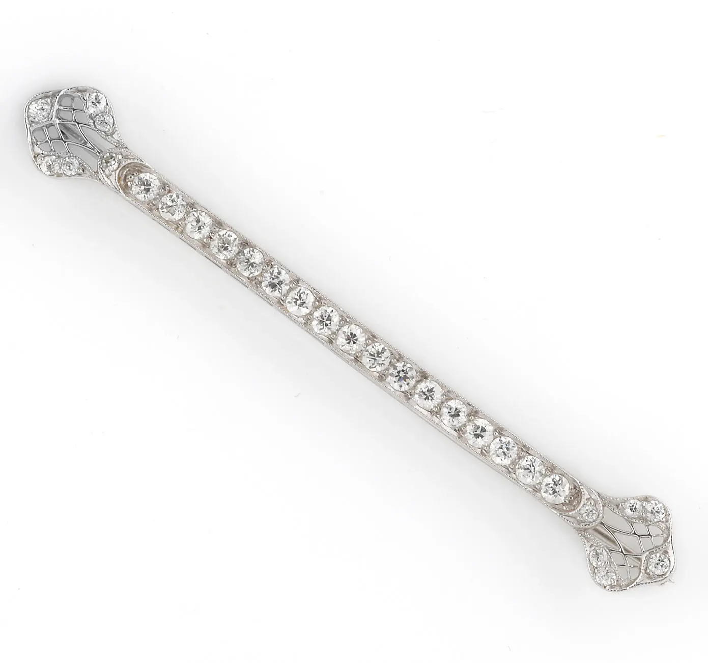 Platinum diamond bar brooch, 3 inches, bead-set old European-cut diamonds in a milgrained line with pierced decorative terminals.