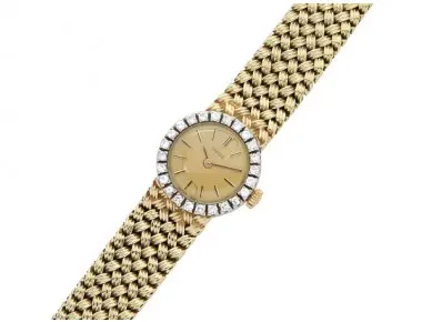 Vintage Concord lady’s wristwatch in 14K yellow gold with diamond bezel, golden baton dial, quartz movement and integrated tapering mesh bracelet, 19 mm case