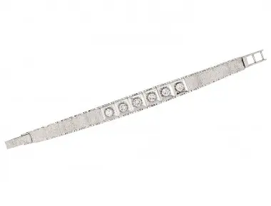 Articulated 18K white gold bracelet with six round diamonds totaling approx. 2.30 carats, textured and polished panels, tapered 11 to 8 mm, length 6 inches