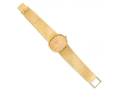 Patek Philippe Golden Ellipse ref. 3545/2 gentleman’s 18K gold wristwatch with textured gilt dial, black baton markers and integrated textured gold mesh bracelet, 32 mm