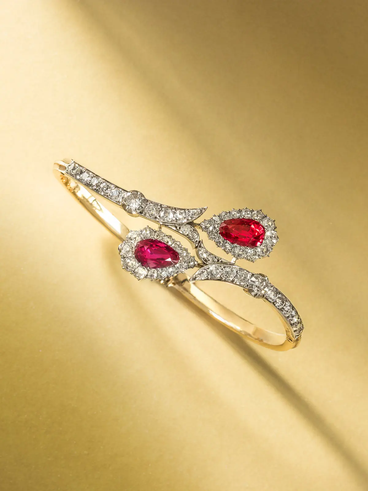 Antique 18th-century bracelet with two pear-shaped no-heat Burmese rubies haloed by old mine-cut diamonds, platinum-topped 18K gold