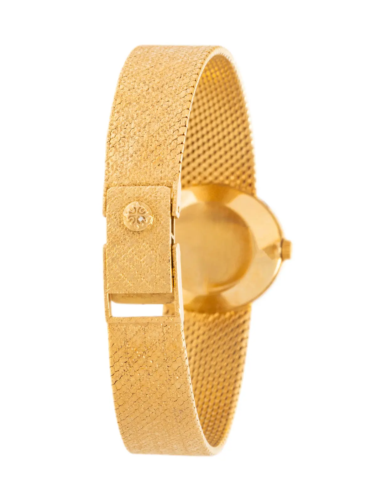 Double-signed Patek Philippe for Tiffany & Co. 18K yellow-gold watch with champagne dial and integrated textured bracelet, manual wind, Swiss hallmarks.