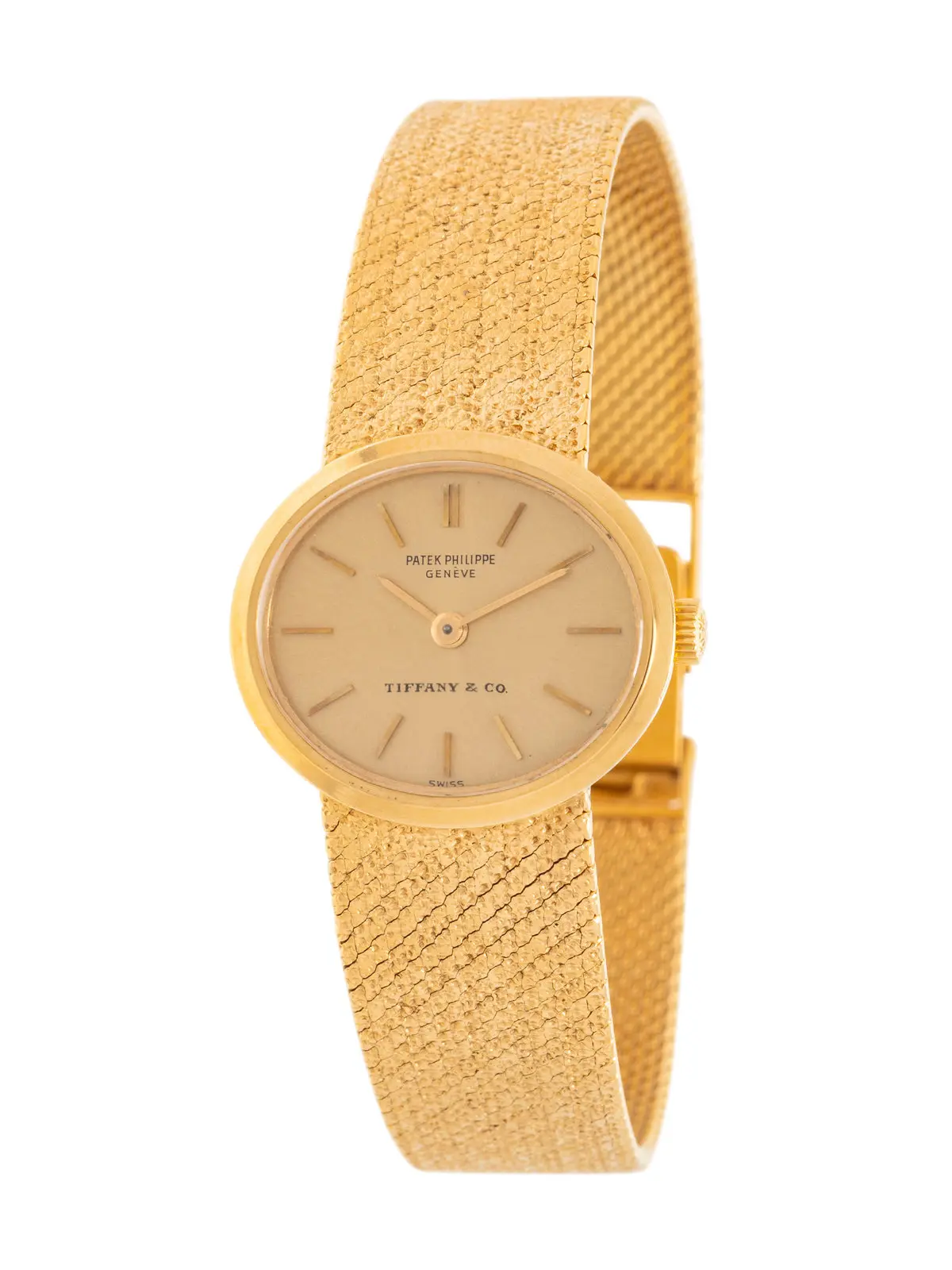 Double-signed Patek Philippe for Tiffany & Co. 18K yellow-gold watch with champagne dial and integrated textured bracelet, manual wind, Swiss hallmarks.